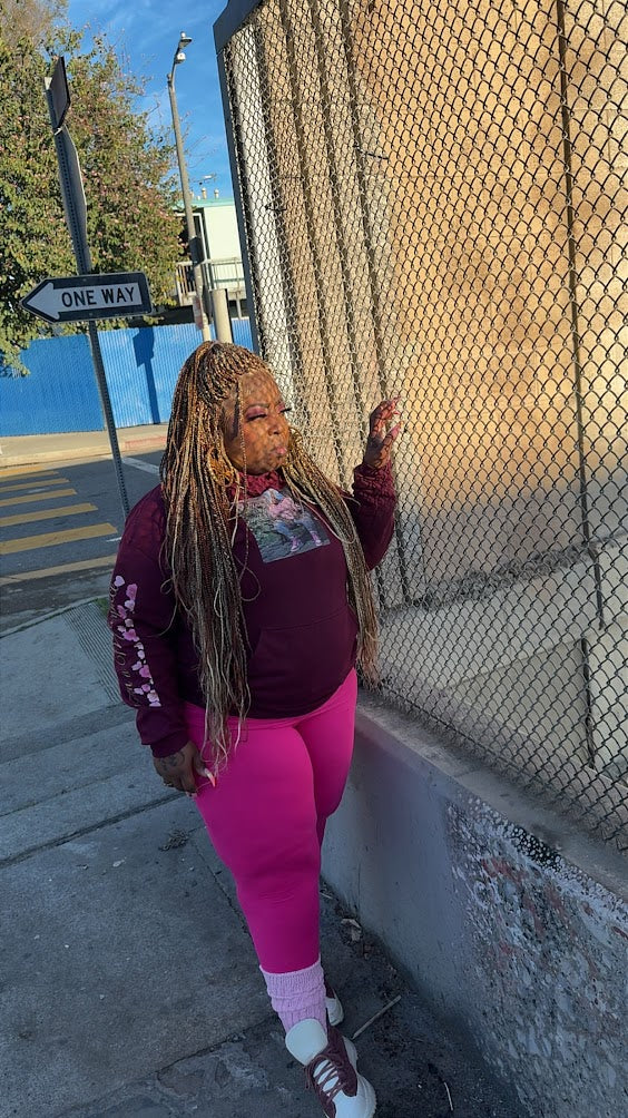 Bree wearing a rich burgundy limited edition hoodie from the Kall Her Beauti™ Vault Collection — exclusive plus size loungewear produced in limited quantities, available while supplies last, sizes S–5XL